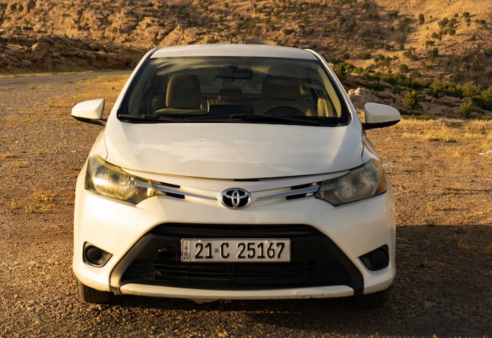 Affordable compact car parked on the street, ideal for budget buyers.